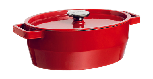 Cocotte ovale en fonte Pyrex® de couleur rouge.