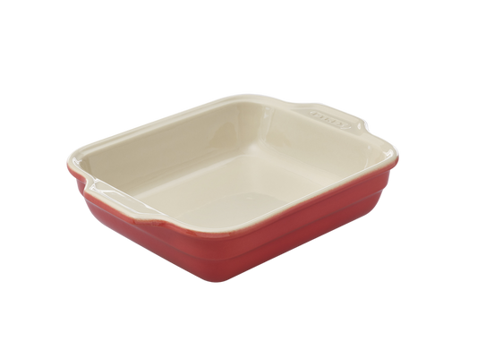 Plat à four rectangulaire en céramique Pyrex® de couleur rouge corail à l'extérieur.