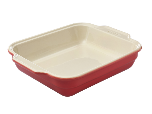 Plat à four rectangulaire en céramique Pyrex® de couleur rouge corail à l'extérieur.
