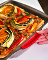 asimetriA - Plaque à pizza en métal avec prise en main facile - différentes tailles & formes