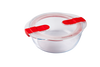 Plat rond en verre avec couvercle en plastique à valves vapeur compatible micro-ondes.